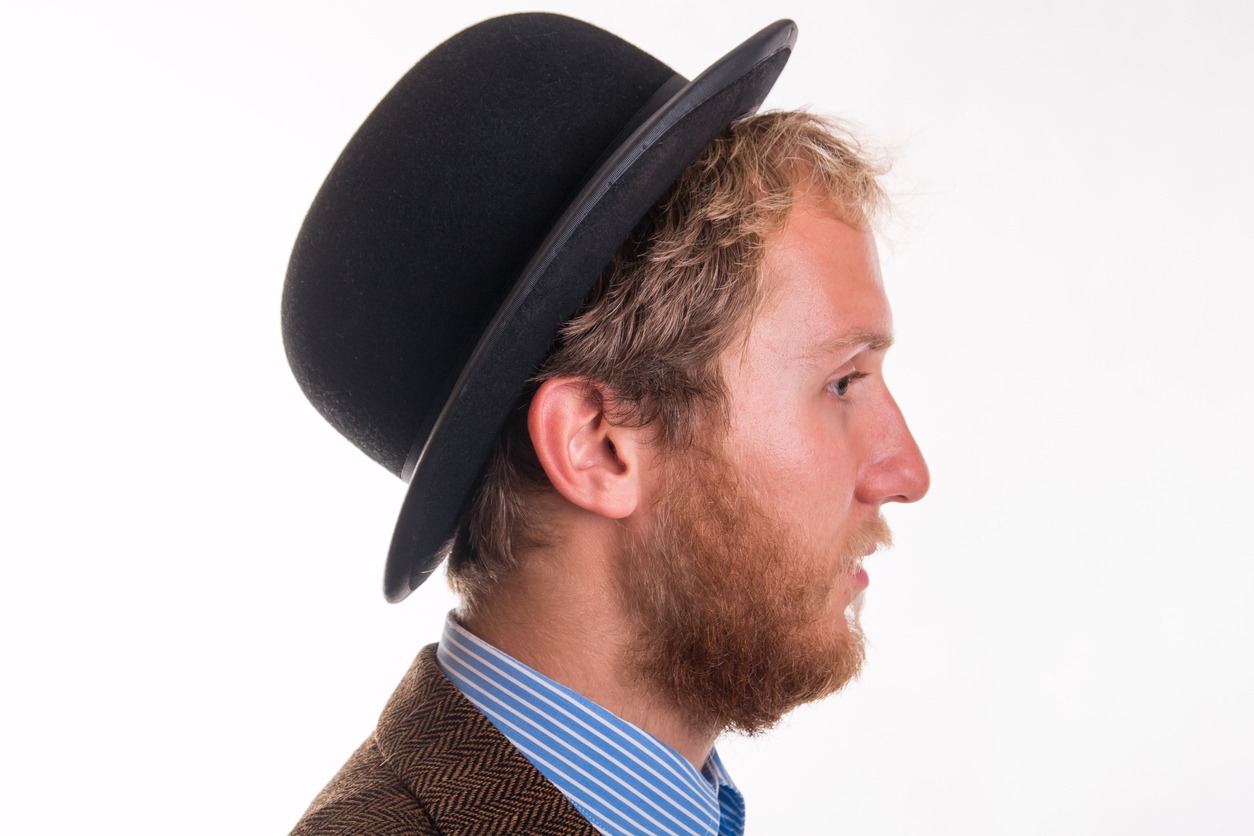 Old-fashioned bearded man with a hat