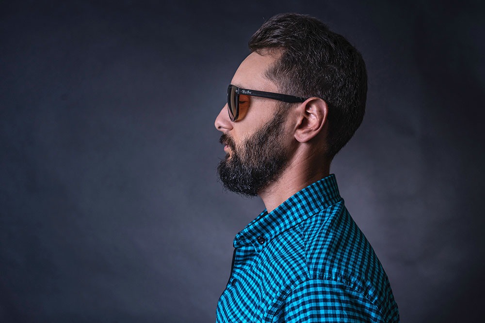 Profile of a bearded man with sunglasses
