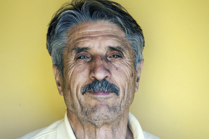 old man sporting a chevron mustache