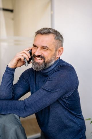 A Bearded Man Having a Phone Call